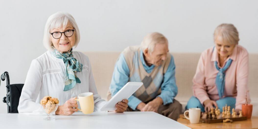 Elderly Woman With Coffee During Recreation Time at Independent Living Facility