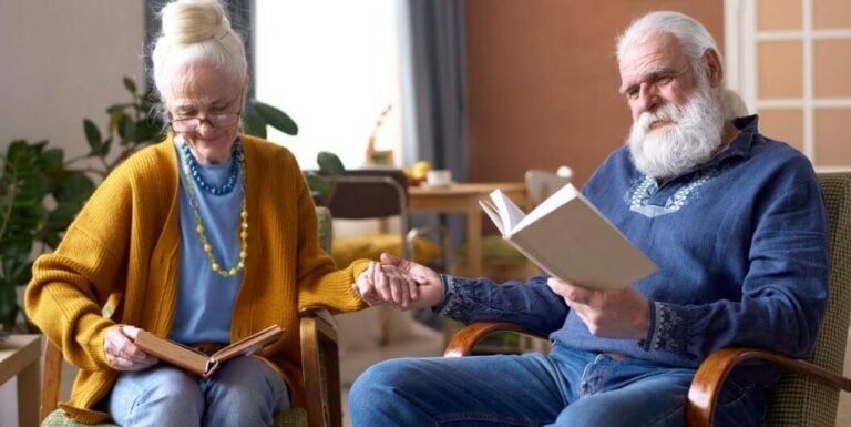 Elderly Couple Reading Books Together at Independent Living Facility