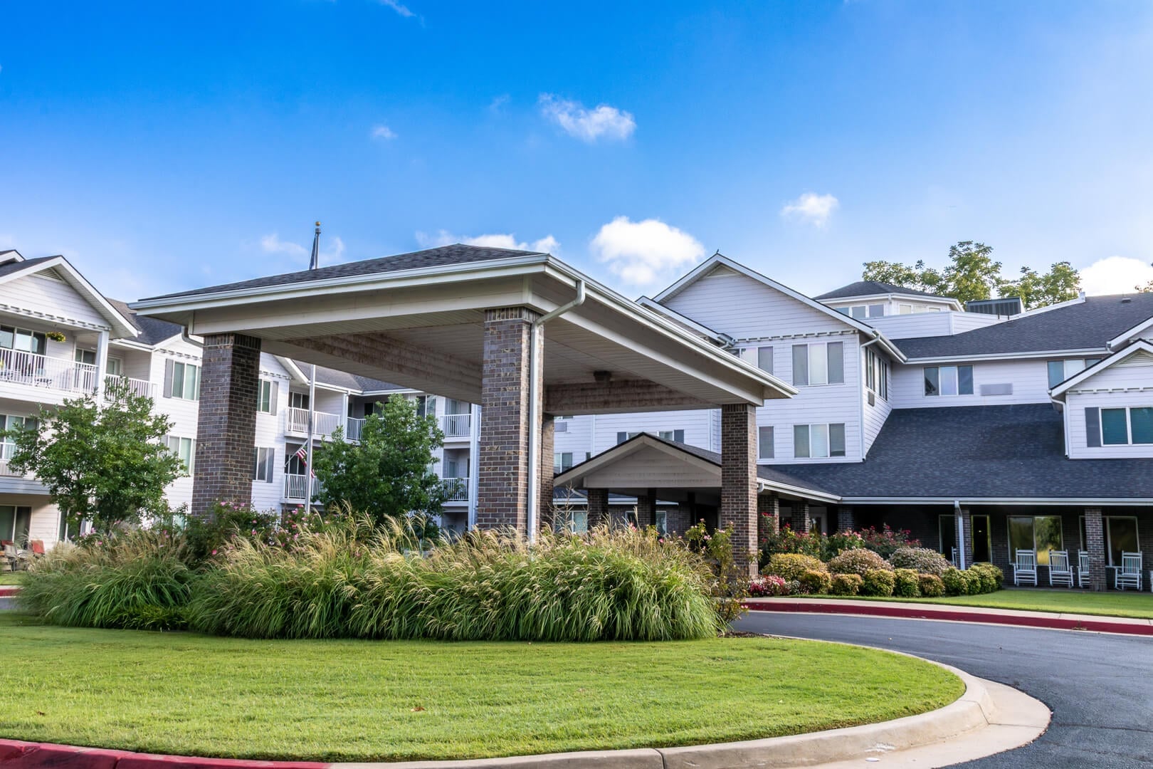 Tree-Lined Covered Entrance Driveway of a Multi-Story Independent Living Facility