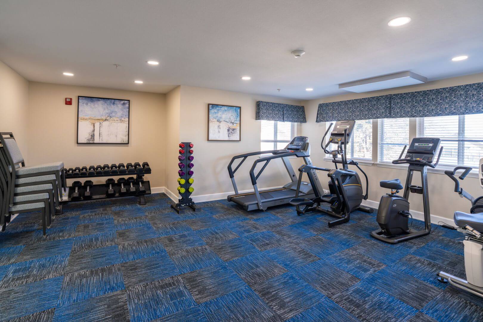 Fully Equipped Fitness Room with Treadmills and Free Weights at an Independent Living Community