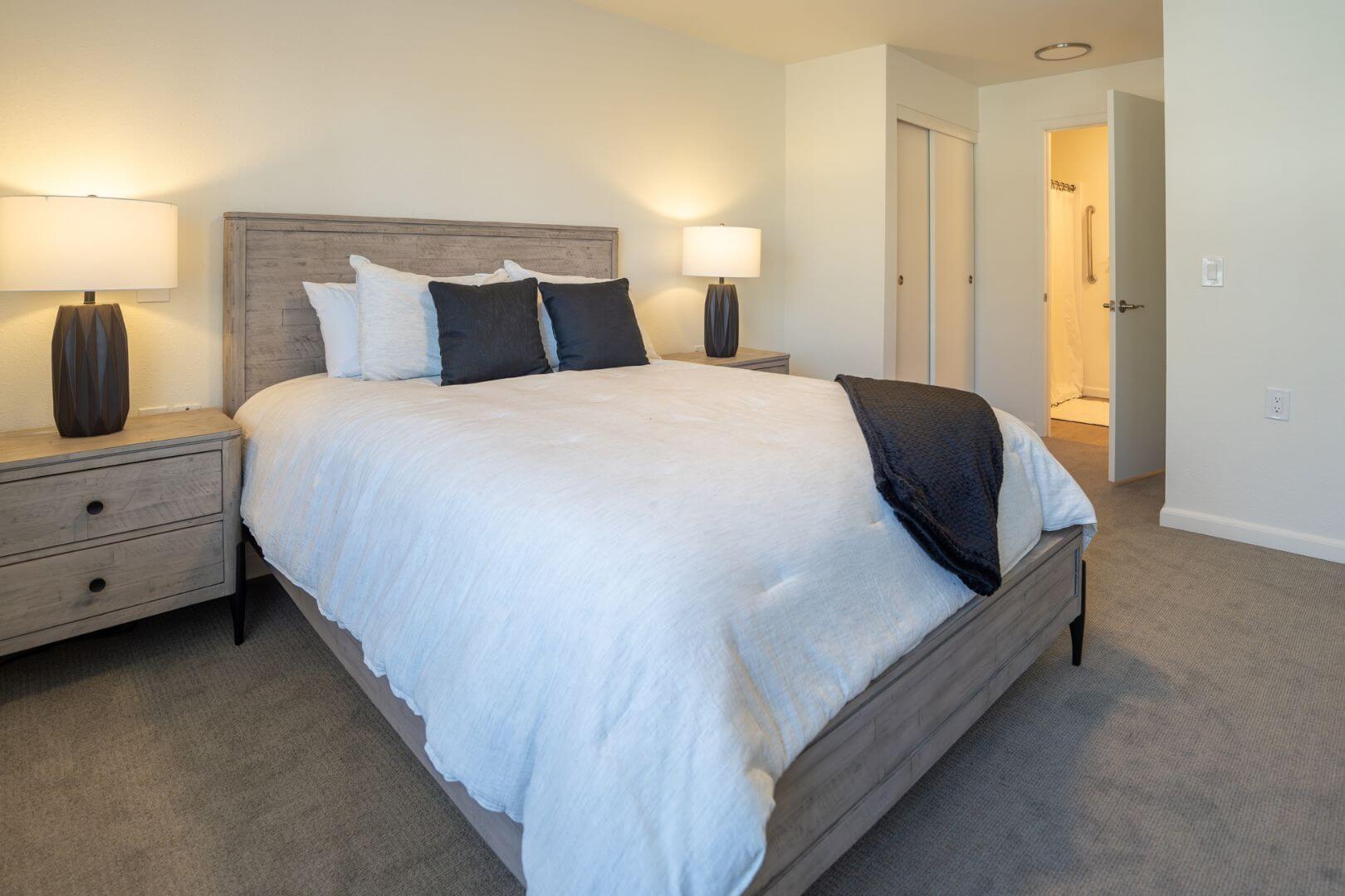 Neatly Furnished Resident Bedroom with Neutral Tones at an Independent Living Facility